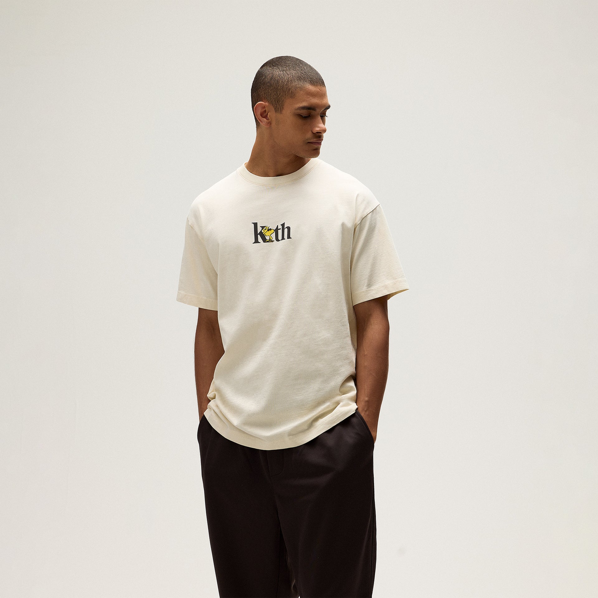 Kith for Peanuts Woodstock Serif Tee - Sandrift